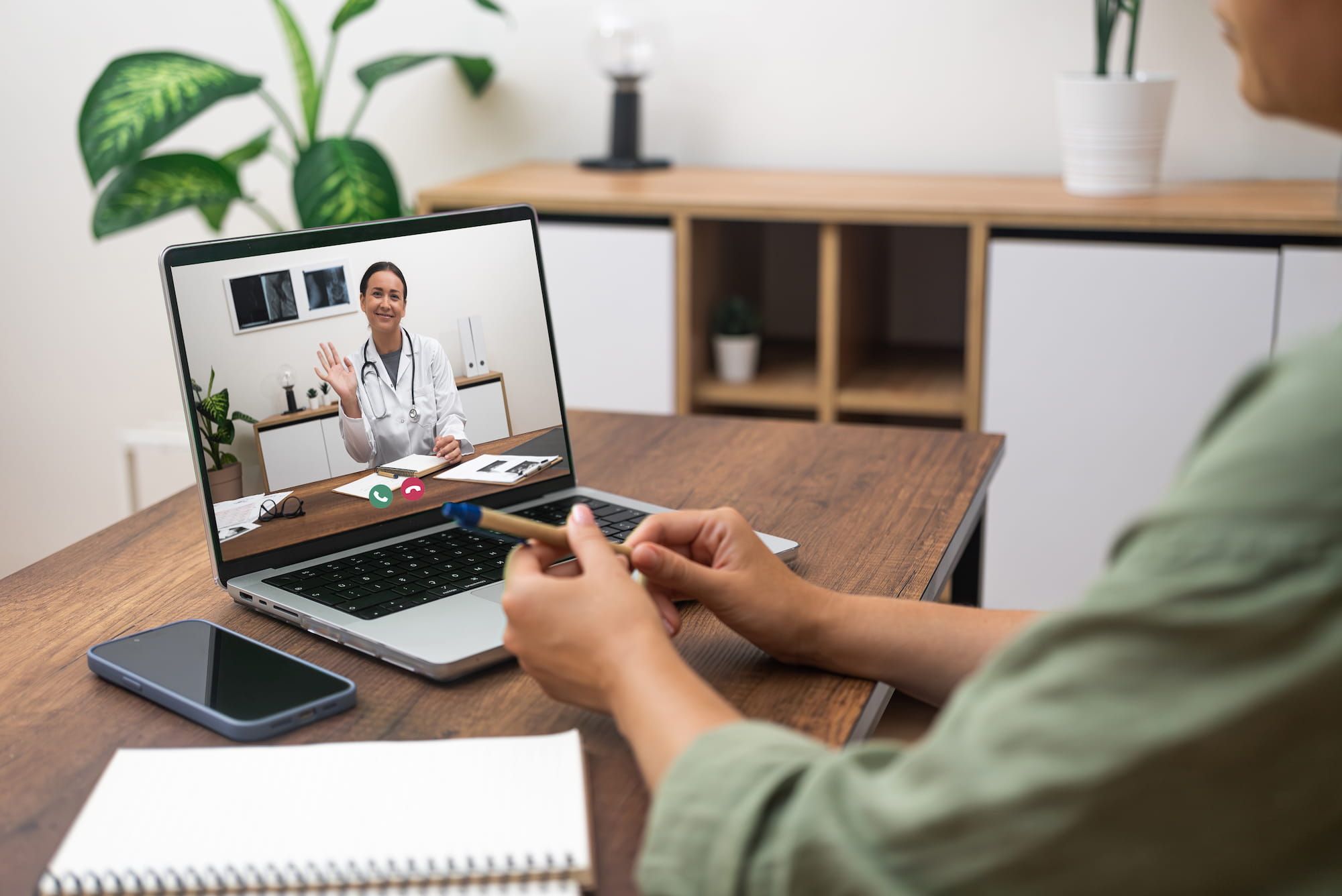 Woman on telehealth video call with a dentist